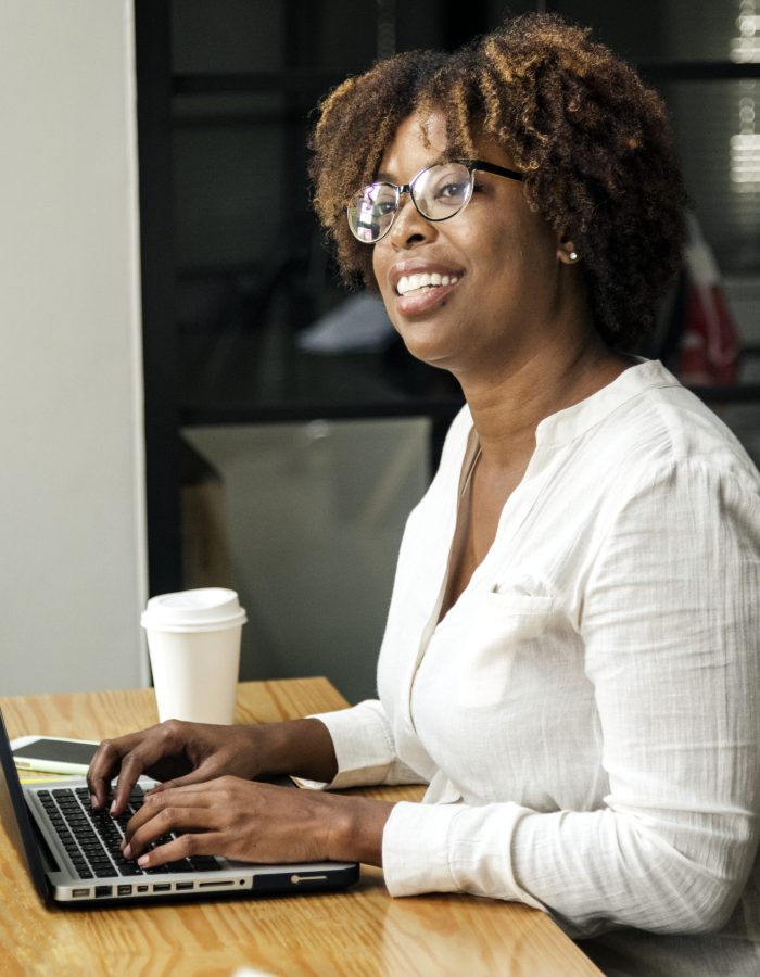 Woman using a laptop in a meeting room